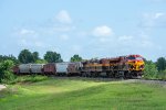 Three GE's lead an empty grain train around the bend 
